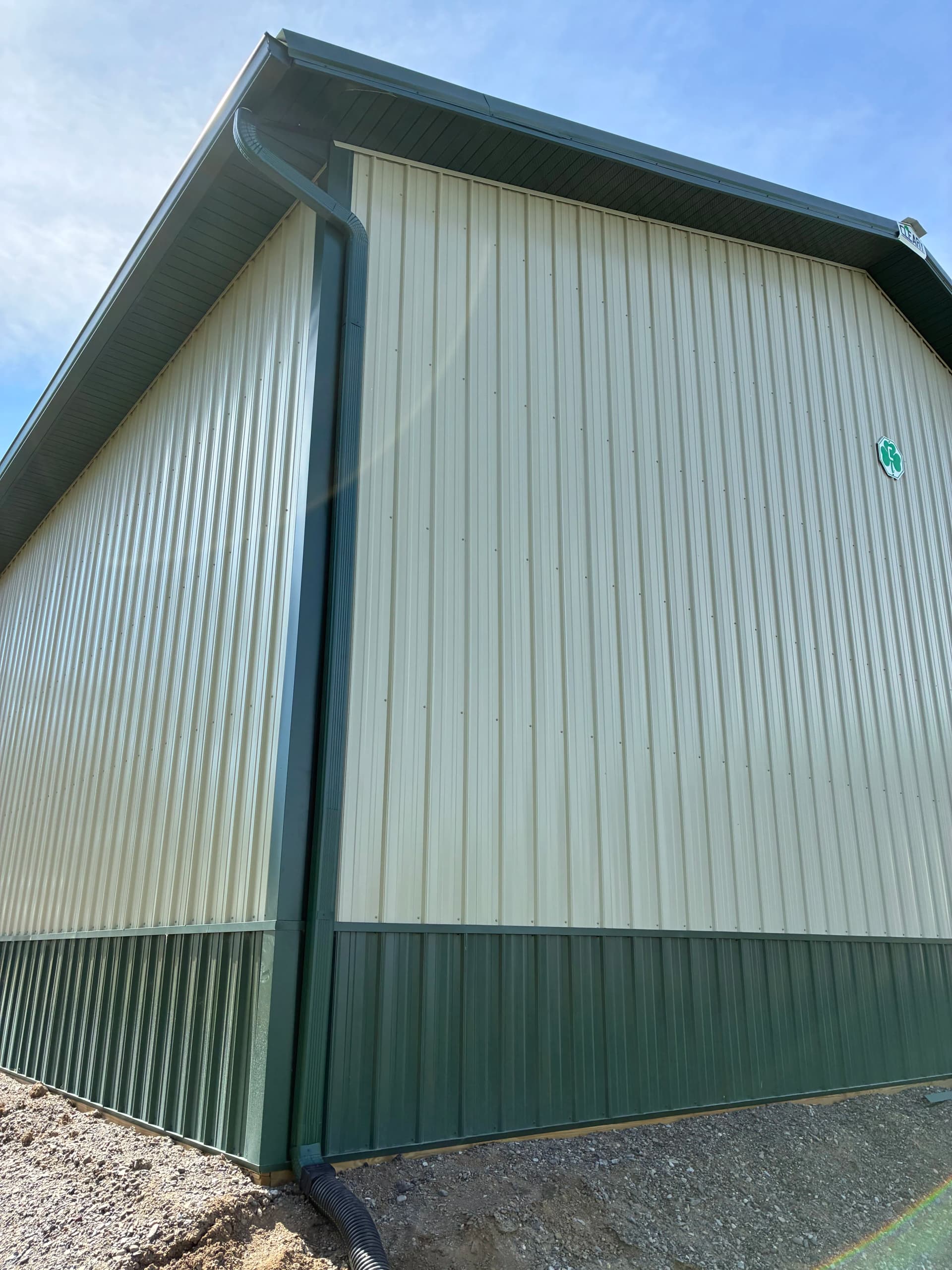 6-Inch Gutters and Snow Guards Installed on Large Pole Building
